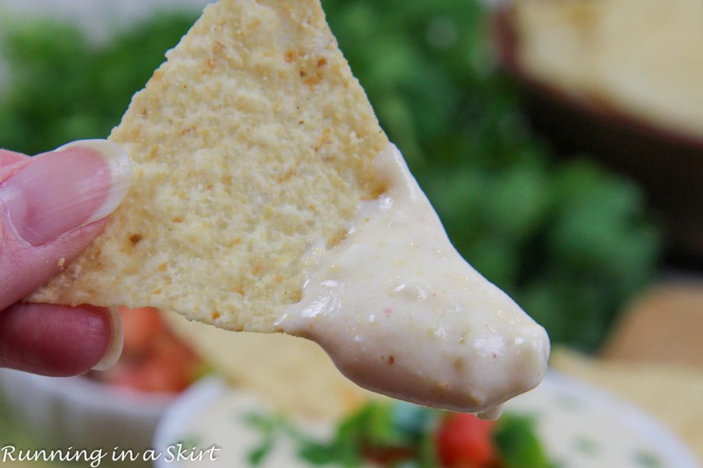 Cottage Cheese Queso Dip close up on a chip.