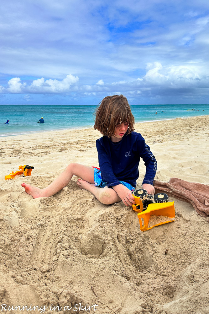 Boy playing on Grace Bay Beach