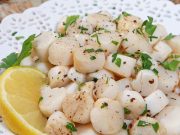Bay Scallops recipe on a white plate.