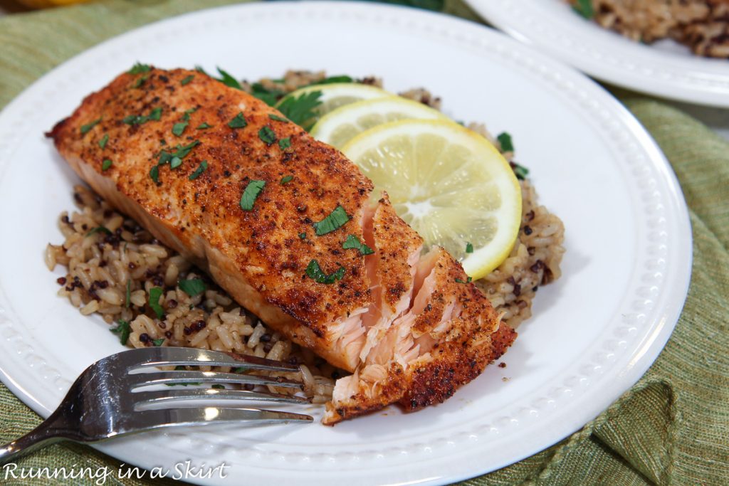 Frozen Salmon in Air Fryer flaking with a fork.