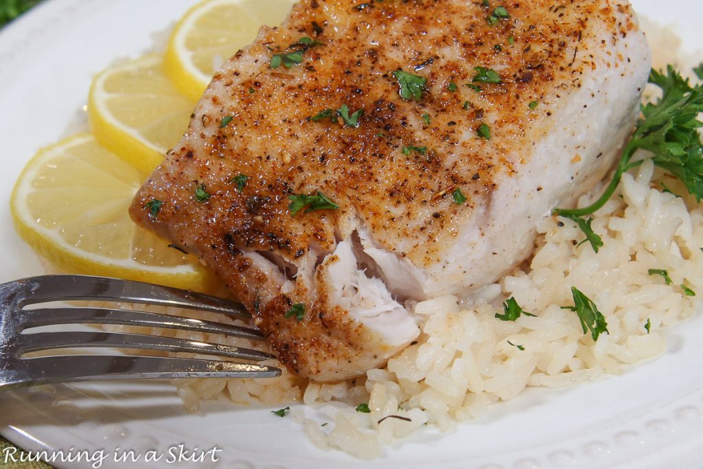 Air Fryer Mahi Mahi close up with fork flaking fish.