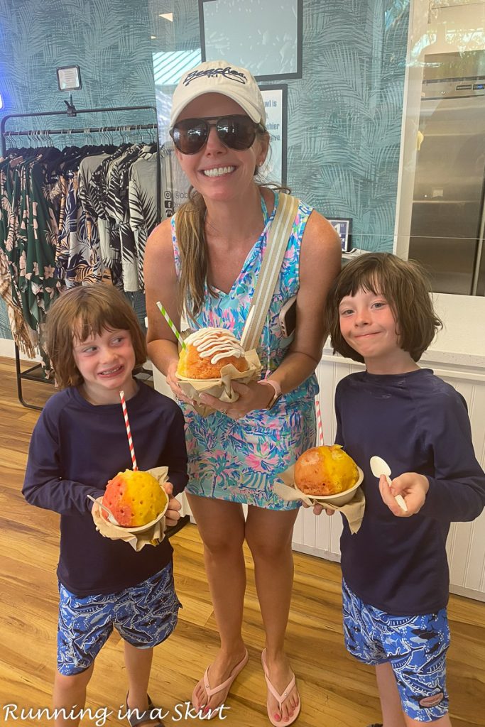 Mom with kids eating shave ice.