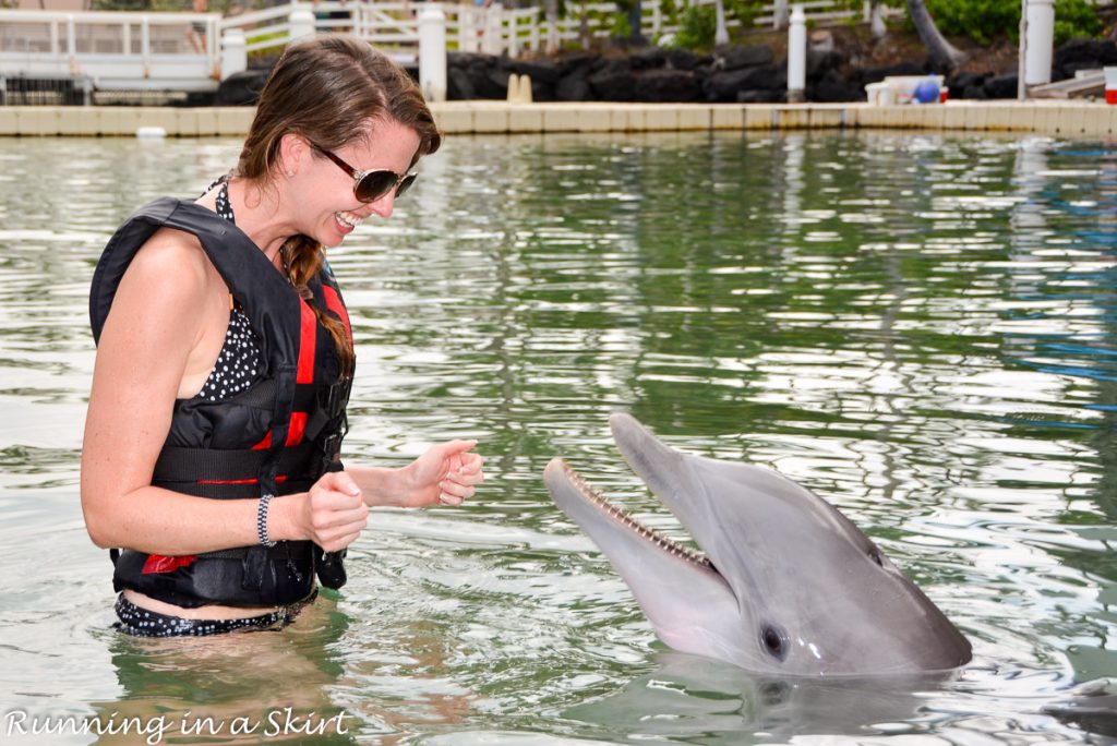Mom swimming with dolpins.