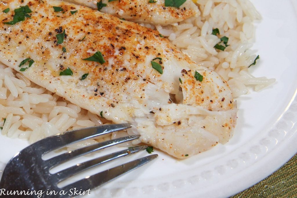 Baked Flounder recipe flaking with a fork.